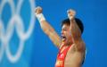 图文-男子举重56公斤级比赛 龙清泉吐出舌头
