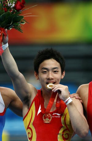 Photo: Zou Kai wins fourth gymnastics gold for host China