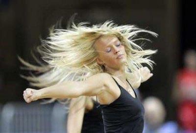 A cheerleader performs during the women's basketball European Championship qualifying round game between Slovakia and Poland in Riga June 11, 2009(Agencies)