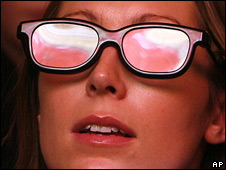 A woman wearing 3D glasses