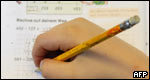 A child writing in a workbook