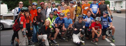 A group of rollerbladers posing for a photo