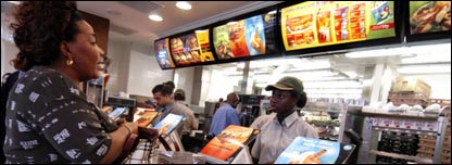 People buying food in a fast food restaurant
