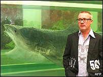 Damien Hirst with his shark in formaldehyde