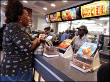 A lady ordering a burger