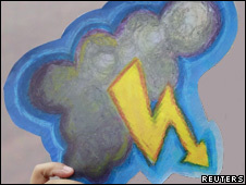 Someone holding a picture of a thundercloud