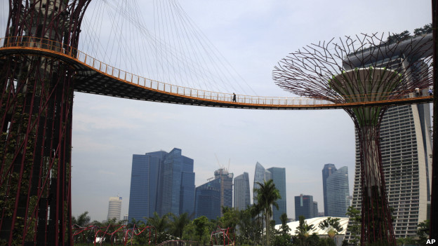 A man walks across the OCBC Skyway in Singapore's busy financial district. 