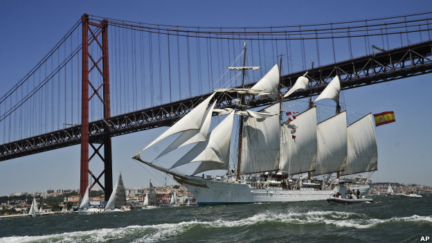 Sailing ship, Juan Sebastian De Elcano, sails up the Tejo River in Lisbon during the 2012 Tall Ships races.