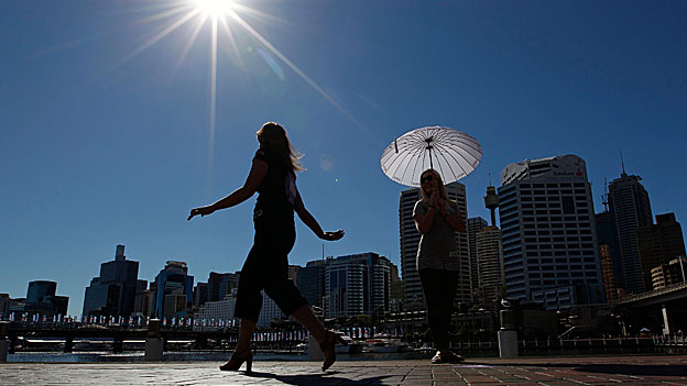 A model walks along an outdoor catwalk in the sunshine in Sydney, Australia.