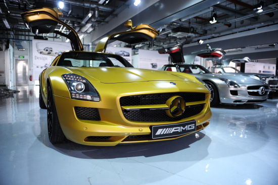 Mercedes Benz released the golden SLS AMG gull wing sports car