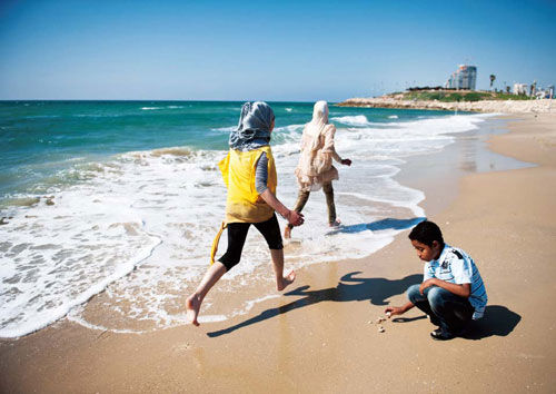 Tel Aviv seaside run across the Arabia girl